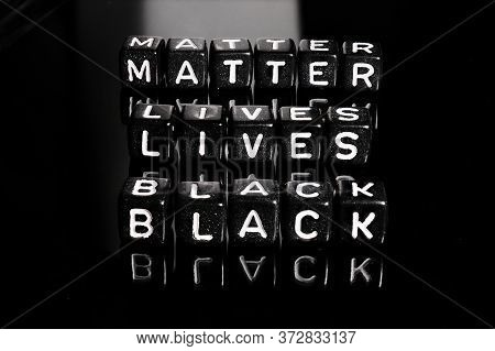 Black Lives Matter Text On A Black Background. Blm In Support Of African Americans People.