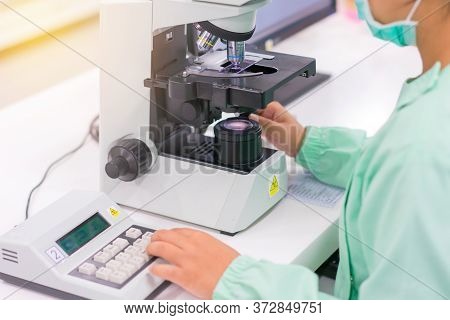 Doctor And Microbiologist With Vacuum Tubes For Samples With Covid 19 Infection Atypical Pneumonia V