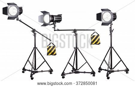 Photo Studio Lighting Stands With Flash And Softbox Isolated On The White.