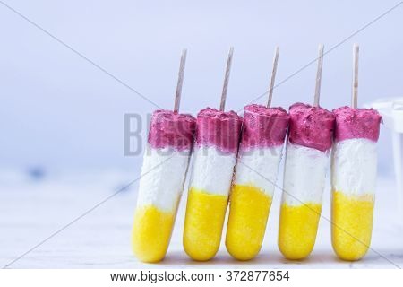 Ice Cream Pops Made With Mango, Raspberry  And Yogurt. Summer Refreshment. Homemade Healthy Dessert.