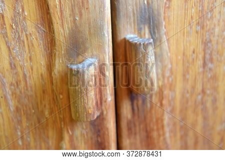 Dirty Old Wooden Cabinet Handles Close Up
