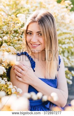 Sensual Calm Portrait Of Beautiful Hipster Woman In Blooming Bush With White Flowers Of Spirea. Copy