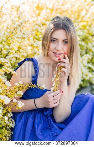 Sensual Calm Portrait Of Beautiful Hipster Woman In Blooming Bush With White Flowers Of Spirea. Copy
