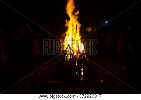 Giant Bon Fire Lit For The Festival Of Lohri Surrounded By People