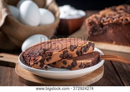 Chocolate Flavor Taiwanese Traditional Sponge Cake (taiwanese Castella Kasutera) On A Wooden Tray Ba