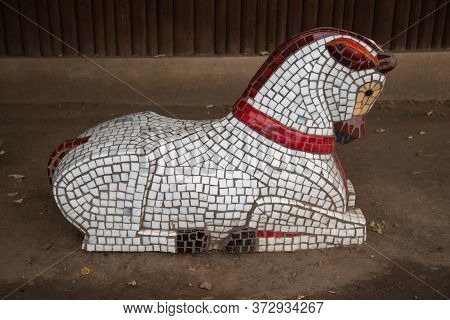 The Figure Of A Horse, Made Of Mosaic White Red. The Design Of The City Park, Art.