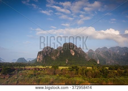 Landscape View Of Mountain With Foggy Under Clear Sky Located At Tropicana Location At Vang Vieang L