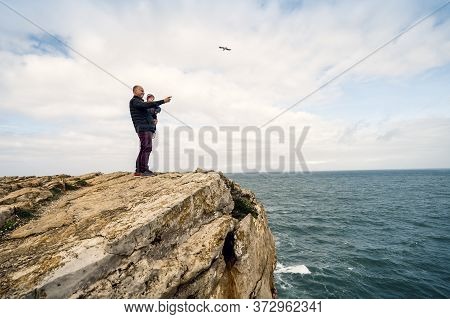 Father And Little Son Admiring Nature In Peniche, Portugal