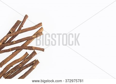 Close Up Of Ayurvedic Herb Liquorice Root,licorice Root, Mulethi Or Glycyrrhiza Glabra Root On A Woo