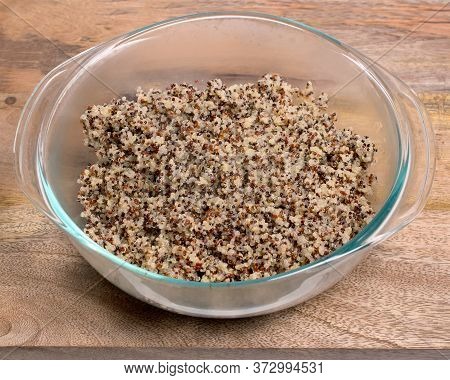 Closeup On Glass Bowl With Cooked Tri-color Quinoa Quinoa On Wooden Background- Quinoa Is A Pseudogr