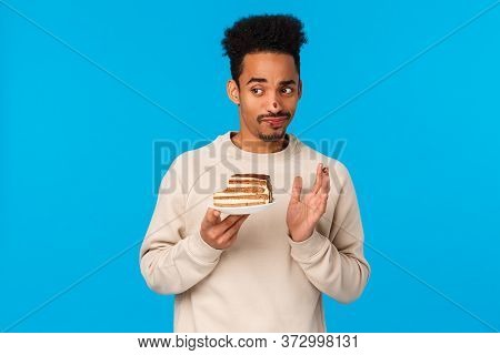 Guy Tried Biting Cake Didnt Like Taste. Displeased And Unimpressed Skeptical, Picky African-american