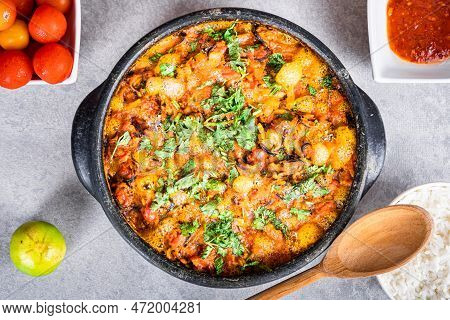 Charru Mussel, Known In Brazil As A Sururu Moqueca, On White Wooden Table, Next To Lemon, Small Toma