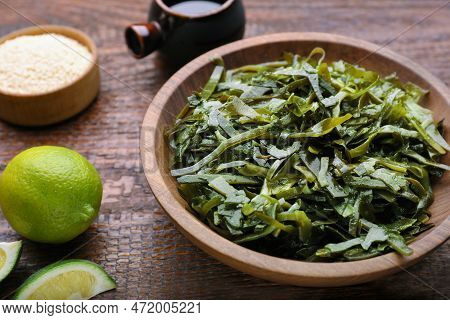 Fresh Laminaria (kelp) Seaweed Served On Wooden Table