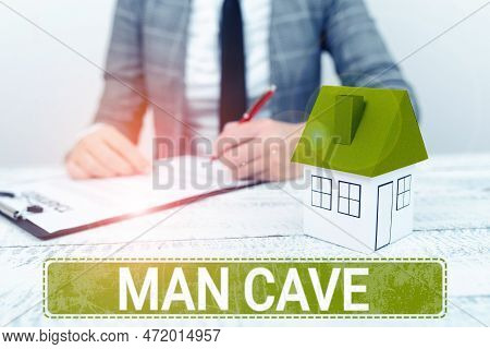 Hand Writing Sign Man Cave. Business Showcase A Room, Space Or Area Of A Dwelling Reserved For A Mal