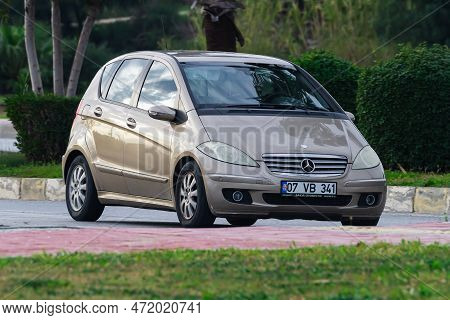 Side , Turkey -  January  29, 2023:   Beige  Mercedes  B-class   Is Driving Fast On The Street On A 