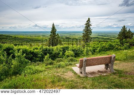 A Bench Overlooking Lookout Point In Cypress Hills Interprovincial Park, Saskatchewan