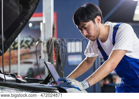 Transportation Repair Service Concept, Repairman Auto Mechanic Using Tablet To Check For Damage Insi