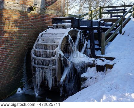 Old Restored Water Mill In Wilsum, Germany After A Extreme Cold Night In Winter. There Is Snow. The 