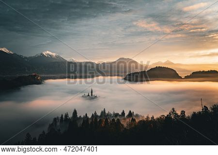 2022 12 30, Bled, Slovenia: Lake Bled Covered In Fog With Island Bled Peaking Through And Castle Ble