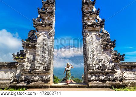 Woman Traveler At  Ancient Gate At Pura Penataran Agung Lempuyang Temple And Volcano Agung On Bali, 