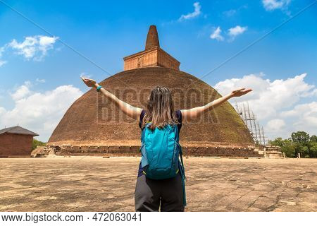 Woman Traveler Near Abhayagiri Dagoba (stupa) In Anuradhapura Archaeological Museum In Sri Lanka