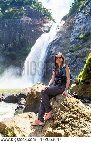 Woman Tourist And Dunhinda Waterfall In A Sunny Day In Sri Lanka