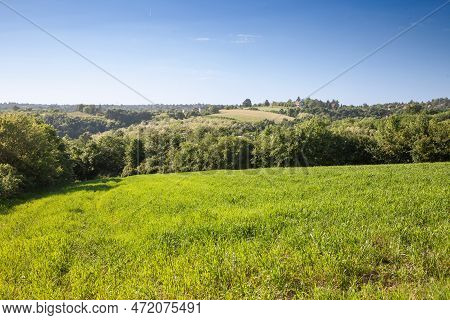 Panorama Of A Typical Serbian Rural Landscape With Farm Estates, Grass Fields, Buildings And Barns S