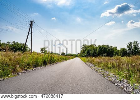 Beautiful Empty Asphalt Road In Countryside On Colored Background