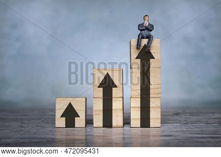 Businessman And Upward Graph Arrow. Self Improvement, Personal Development, Upskill And Success Conc