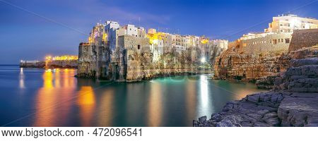 Fantastic Night Scene At Cala Paura Gulf With Bastione Di Santo Stefano In Village On The Rocks Poli
