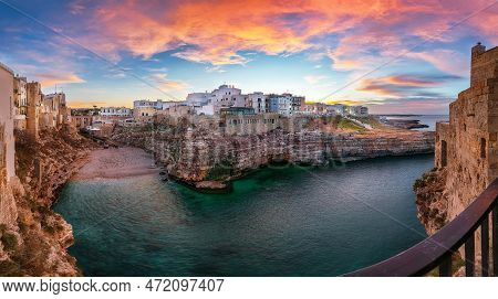 Stunning Sunset At Cala Paura Gulf With Bastione Di Santo Stefano And Lama Monachile Beach In Backgr