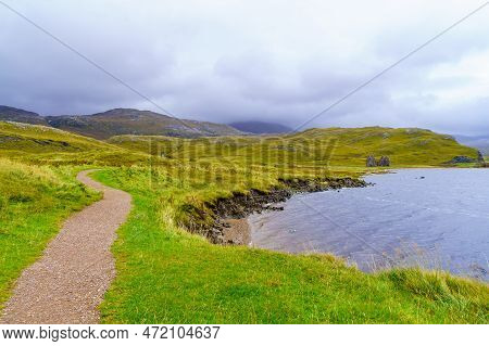 View Of Footpath And The Ruined Calda House, Loch Assynt, In The Highlands, Scotland, Uk