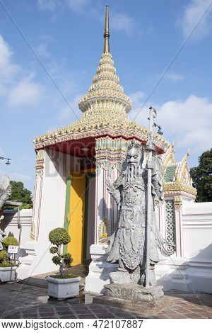 Cloister Of Wat Pho Temple With Chinese Guardian Statue In Bangkok