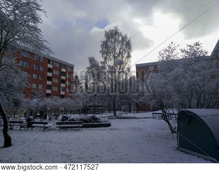 Trees And Buildings Against Sky During Winter
