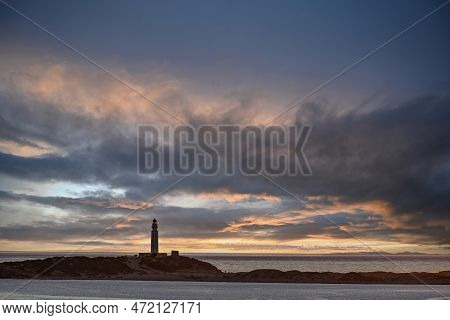 Beautiful Sunset On The Beach Of Los Caños De Meca With The Background Of The Trafalgar Lighthouse, 