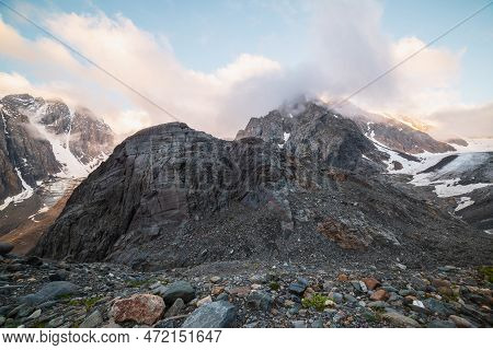 Scenic Mountain Landscape With Sharp Rocks In Low Clouds In Golden Sunrise Colors. Awesome View To R