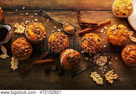 Pumpkin Muffins With Oat And Brown Sugar Crumble On A Rustic Wooden Surface Served With Tea