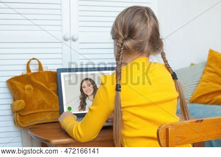 Online Lesson. School Shild Girl Using Laptop At Home