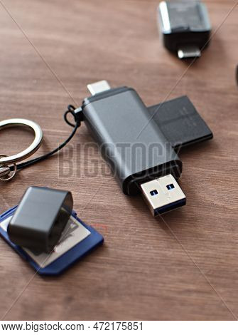 Memory Card Adapter And Memory Card On Wooden Table