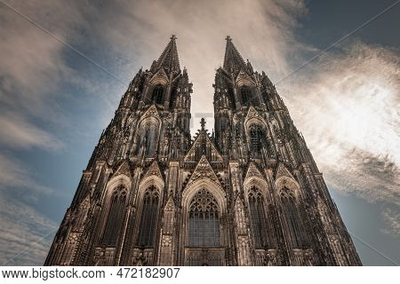 Cologne Cathedral Seen From Below With Blue Sky. Cologne Cathedral, Or Kolner Dom, Is The Main Landm
