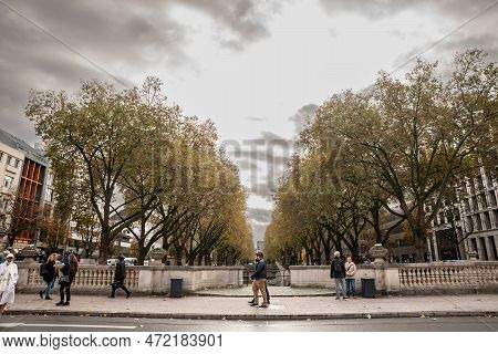 Dusseldorf, Germany - November 7, 2022: People, Germans, Walking By The Konigsallee Of Dusseldorf In