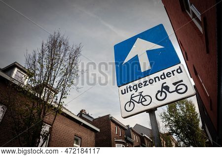 Sign Indicating A One Way Street With A Blue Background And A White Arrow, At The Exception Of Bicyc
