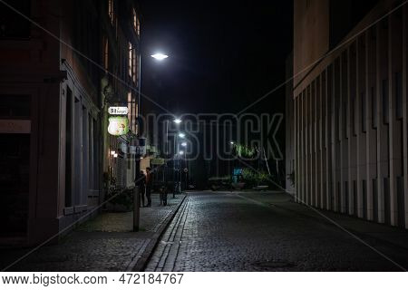 Aachen, Germany - November 8, 2022: Selective Blur On The Rennbahn Street Of Aachen At Night, Empty,