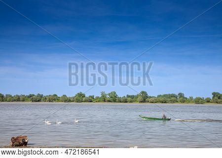 Krcedin, Serbia - June 12, 2022: Old Motorboat, A Speedboat Of Fishermen, Navigating On The Danube R