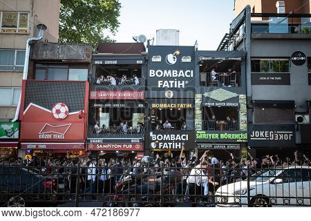 Istanbul, Turkey - May 21, 2022: Group Of Supporters; Footbal Ultras, Passing In Front Of A Bar Of B