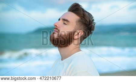 Happy Handsome Free Guy, Young Calm Relaxed Carefree Man Traveler Enjoy Sea On Beach, Ocean View, Pe