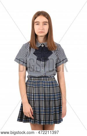 Young Beautiful Girl In A School Uniform On A White Background, Sad Expression Like A Smooth-head Bl