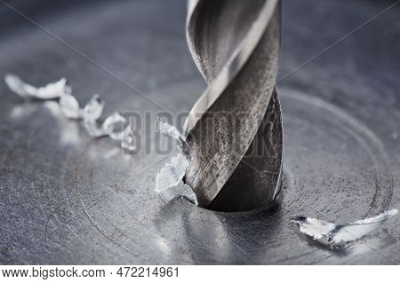 Metal Drill Bit Make Holes In Steel Billet On Industrial Drilling Machine. Metal Work Industry. Mult