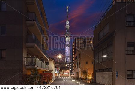 Tokyo, Japan - March 25 2023: Tokyo Skytree Tower At Sunset With The Stone Torii Gate Street Of Ushi