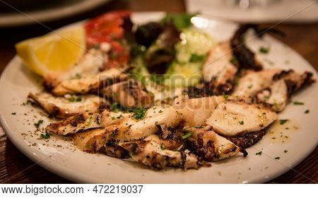Traditional Mediterranean Appetizer With Octopus And Lemon